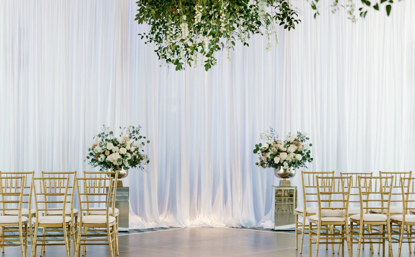 white draped ceremony backdrop gold chiavari