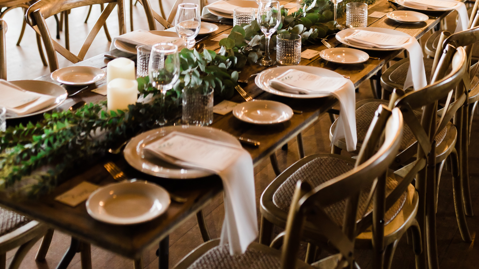 long wood table gold chargers greenery runner