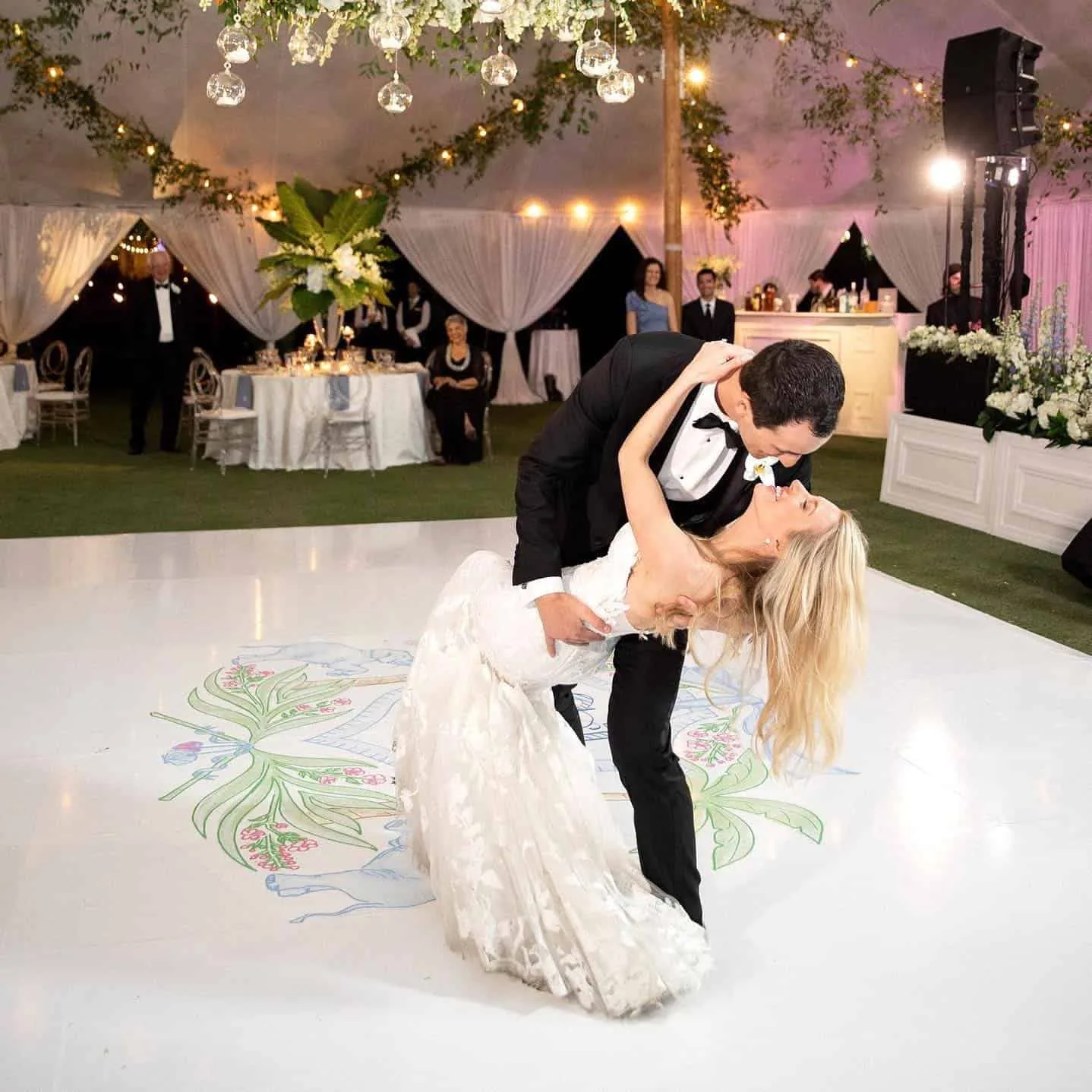 Groom dipping bride on a dance floor