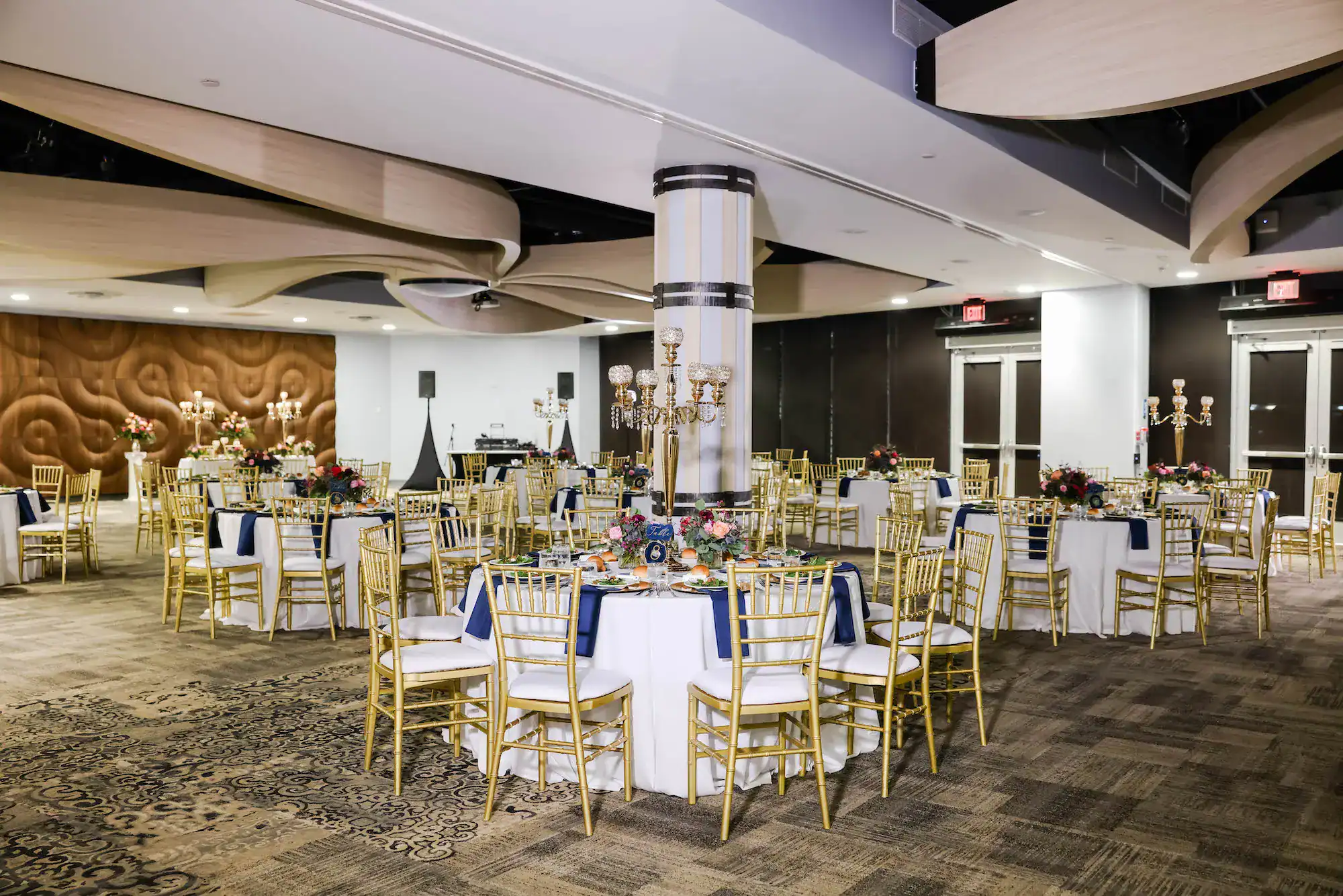 Florida Aquarium wedding rentals inspiration shown through blue reception tables and guest seating