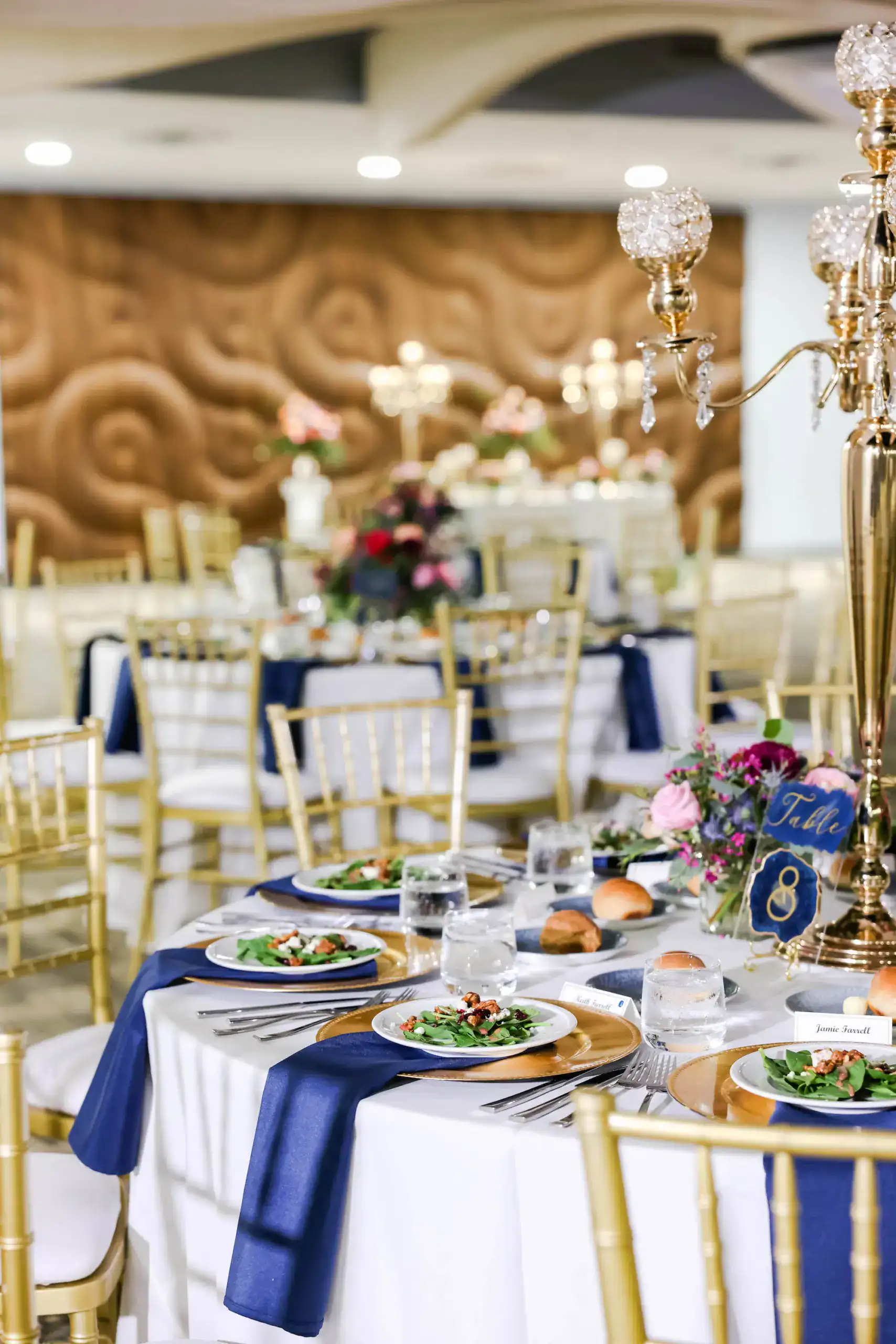 Reception room with coordinated tables chairs and blue design accents