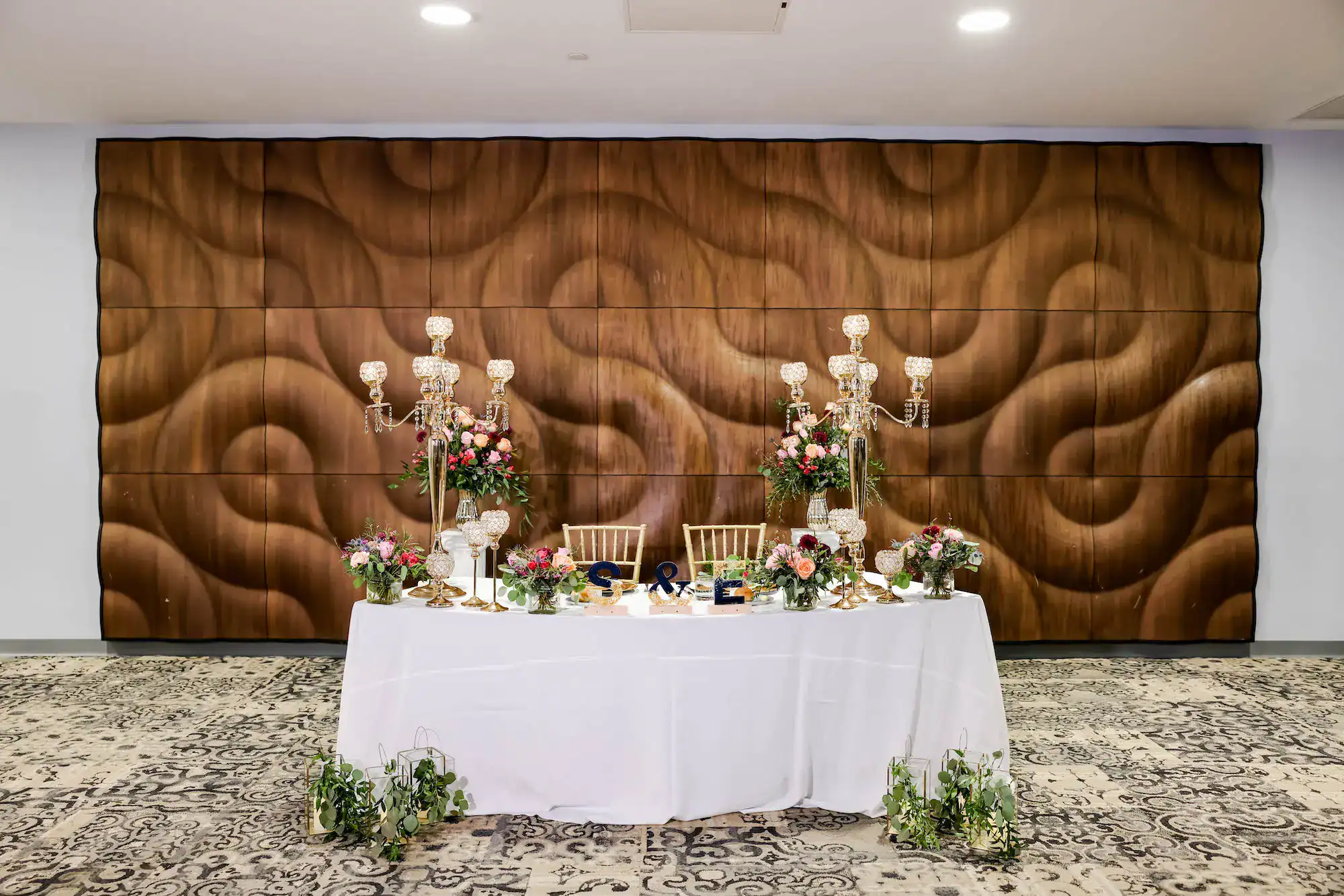 Head table and reception decor arranged for the aquarium celebration