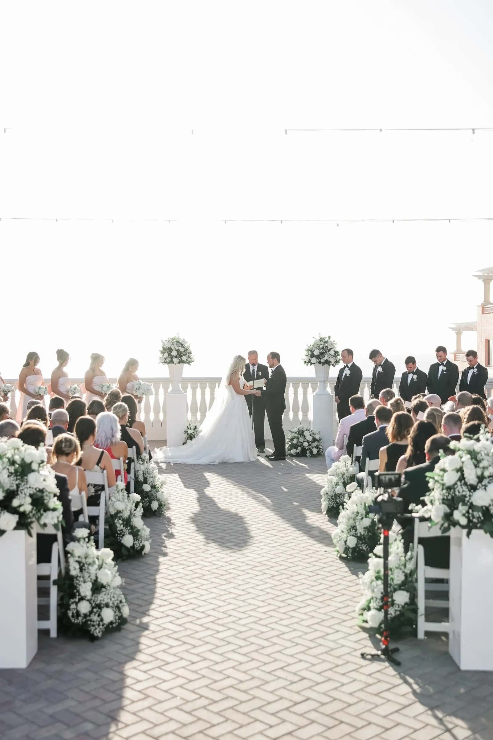 Bride and groom exchanging vows on the oceanview balcony at the Hyatt Regency Clearwater Beach