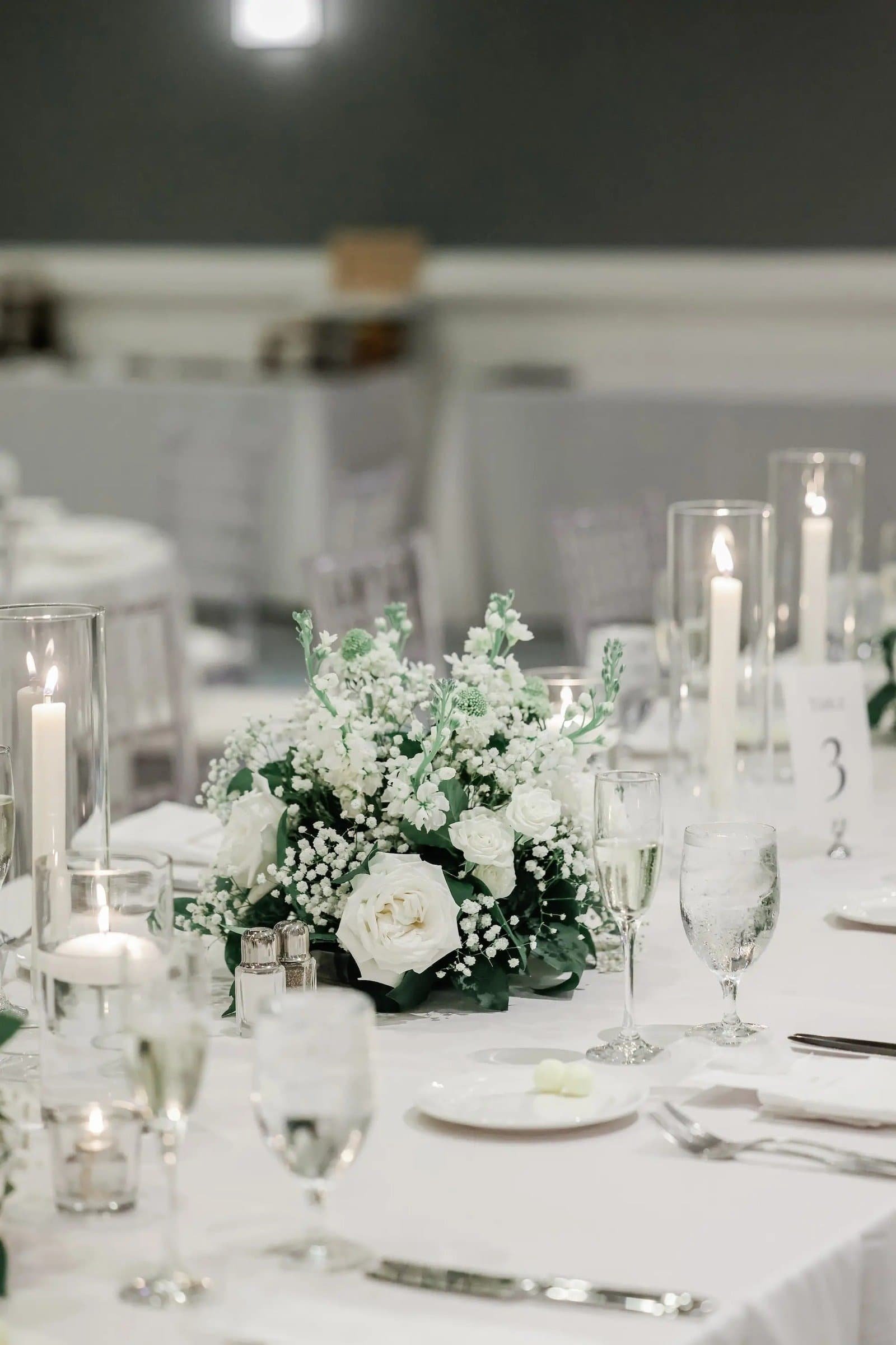 White linen tablescape with romantic white taper candles