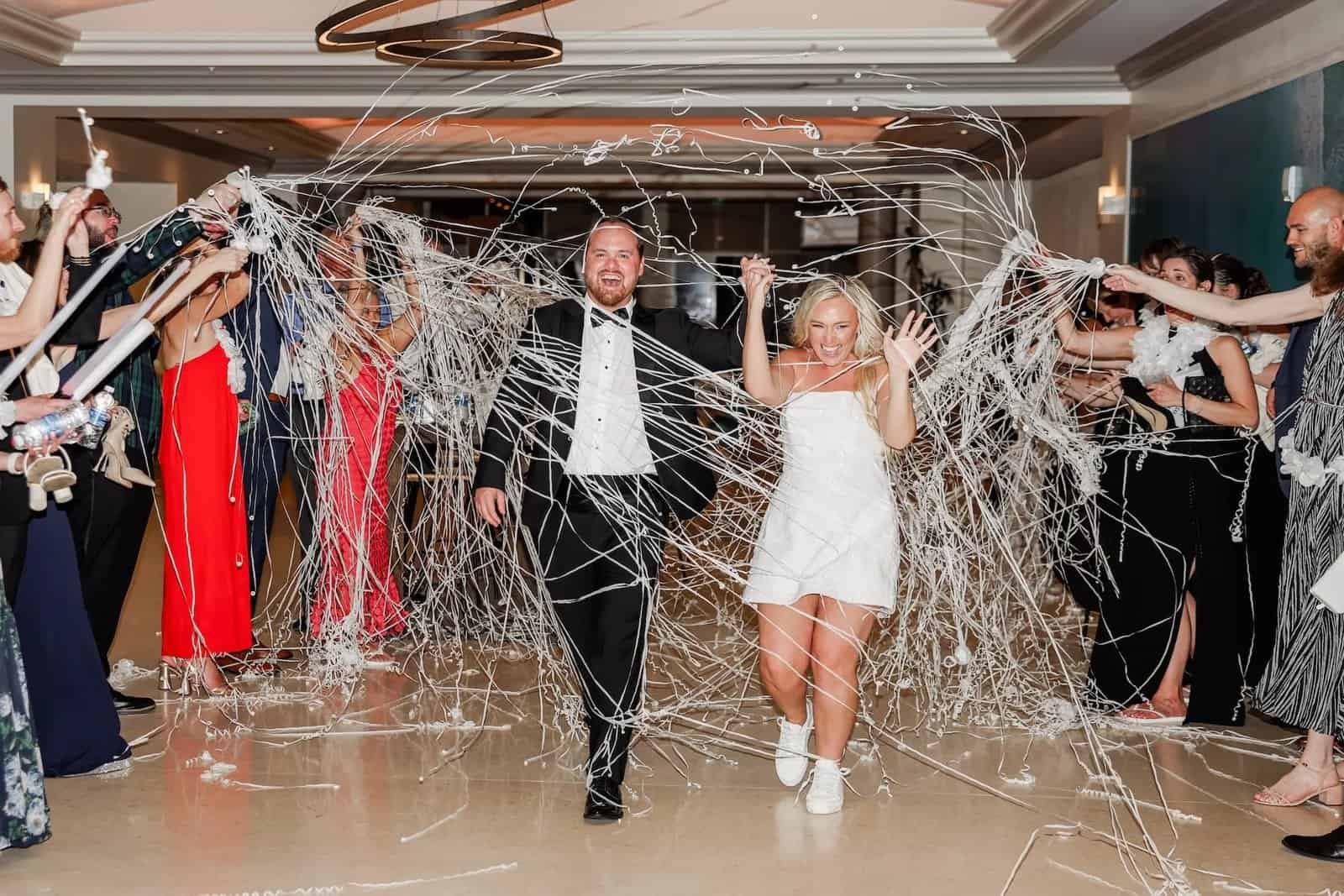 Bride and groom streamer exit at their Clearwater Beach wedding reception