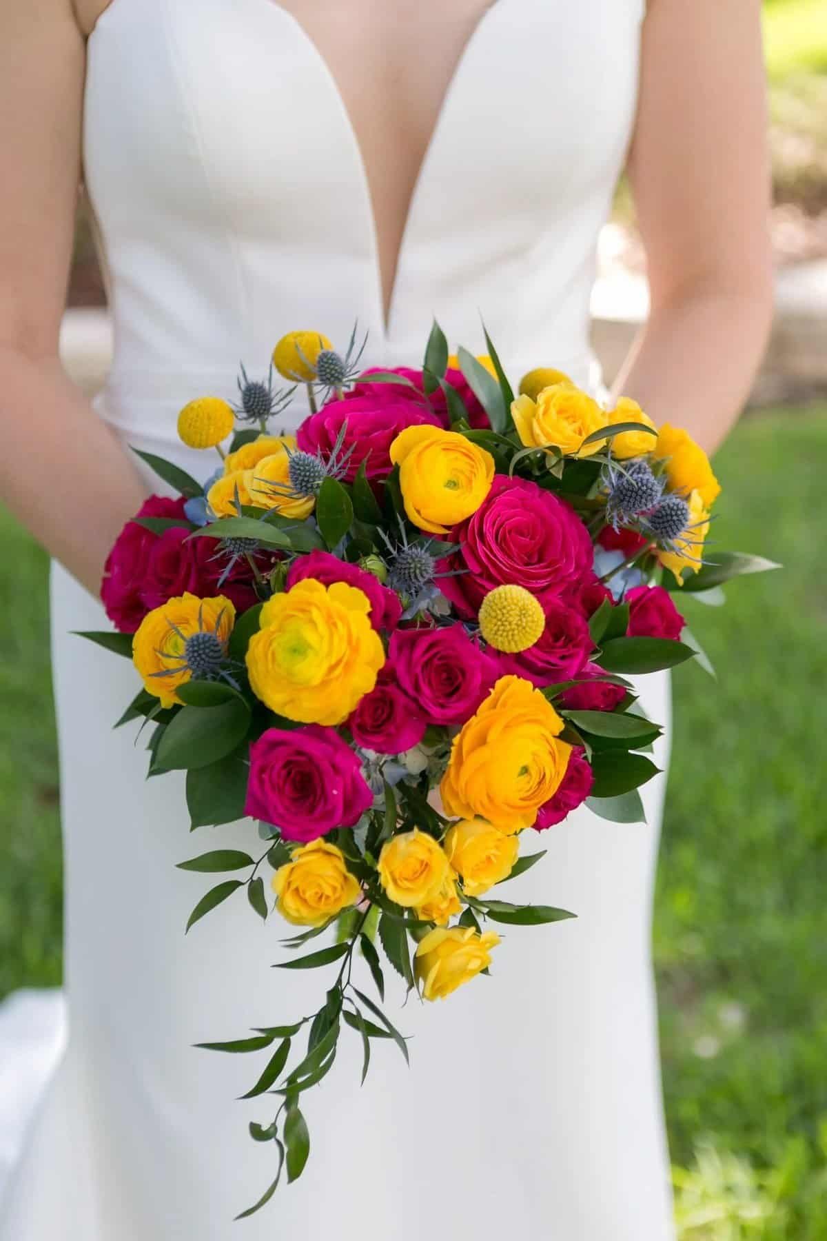 Wedding bouquet of yellow, fuchsia and blue blooms