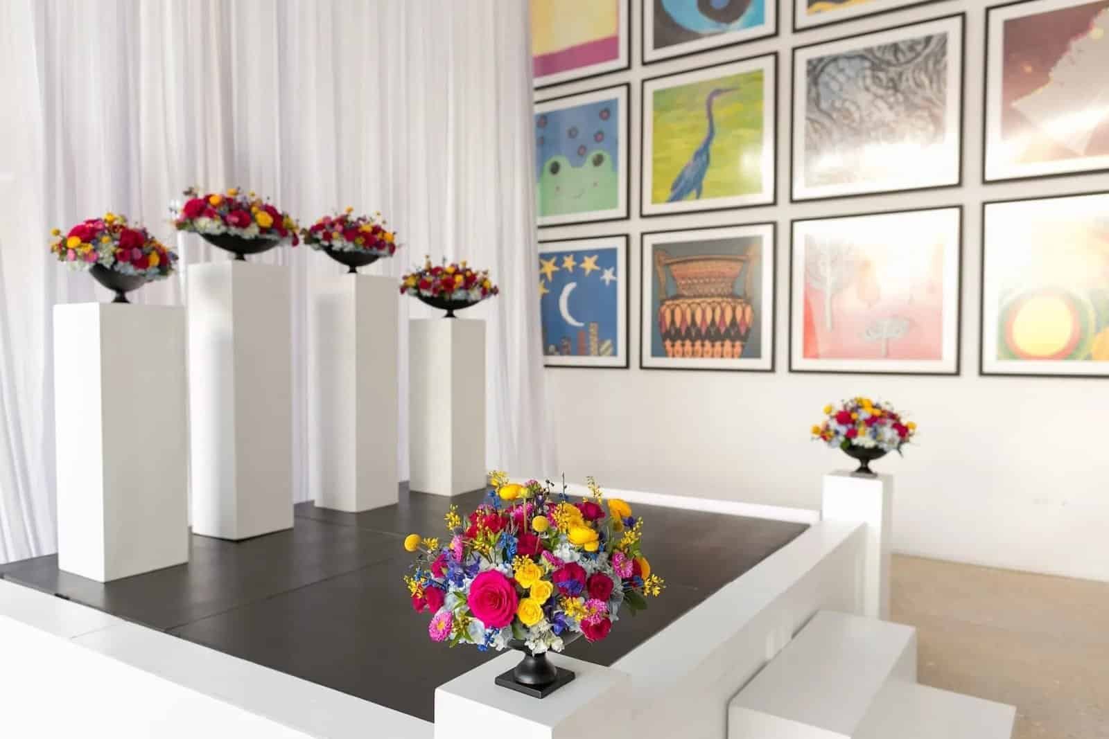 Modern museum waterfront ceremony with white draping and sleek aisle seating at The Dali Museum