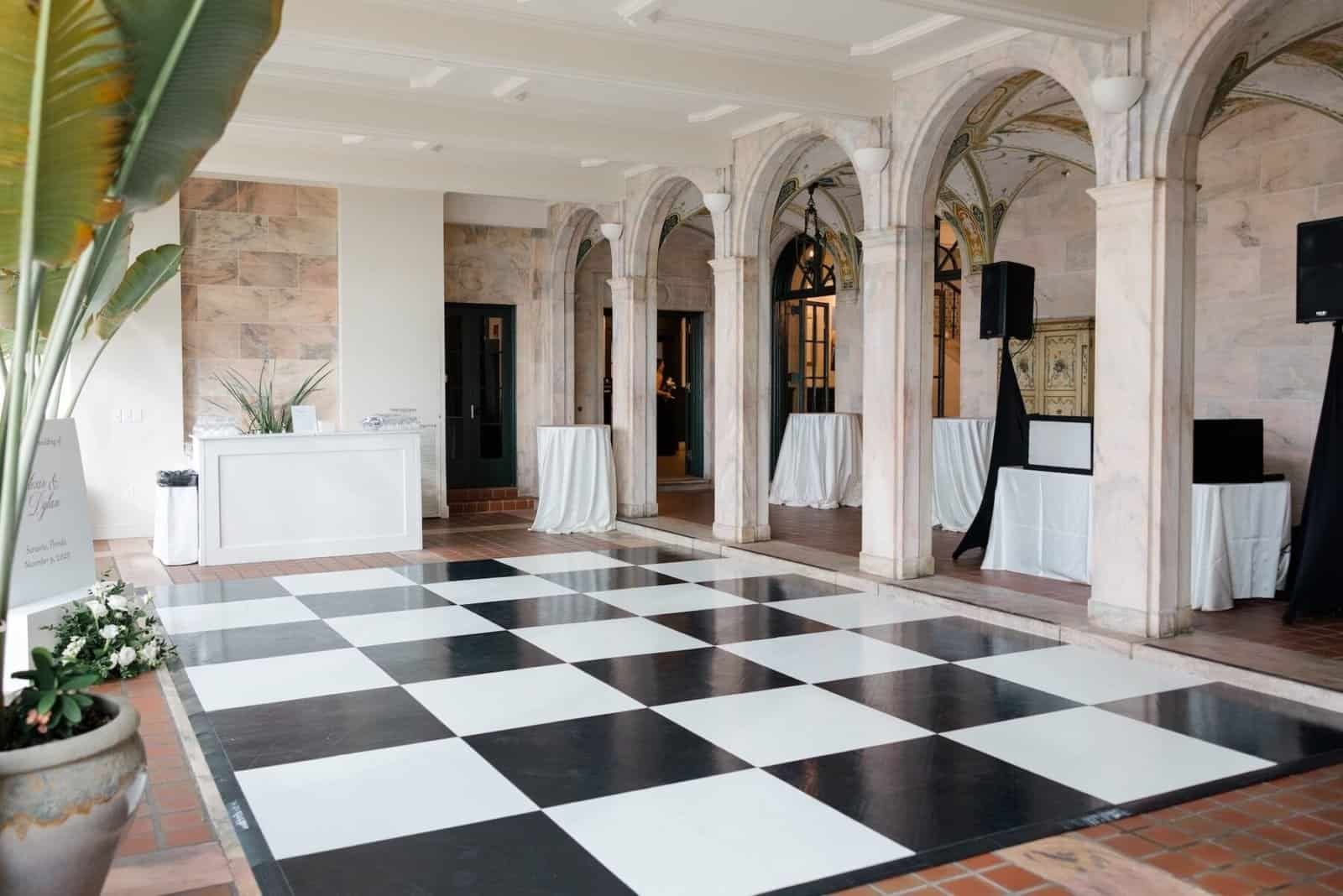 Timeless black and white wedding inspiration at New College of Florida, Sarasota — chairs and dance floor by Gabro Event Services