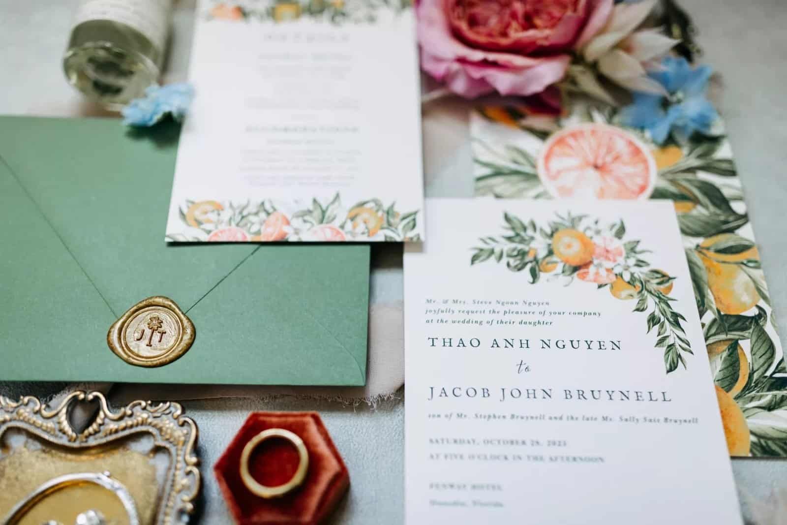 Coral florals and rustic table settings at a Dunedin wedding