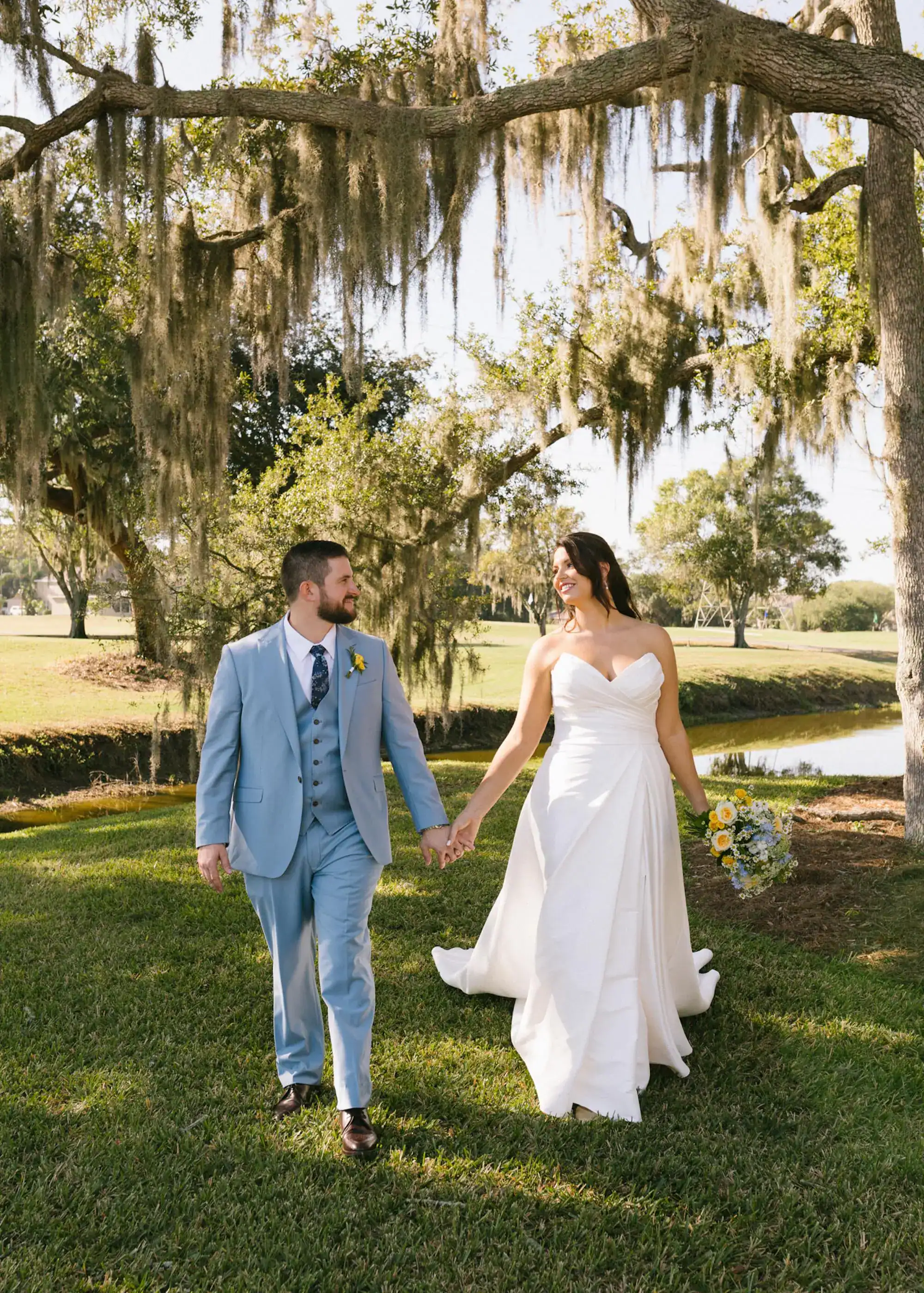 A sunny outdoor ceremony terrace at Ardea Country Club with yellow floral accents.