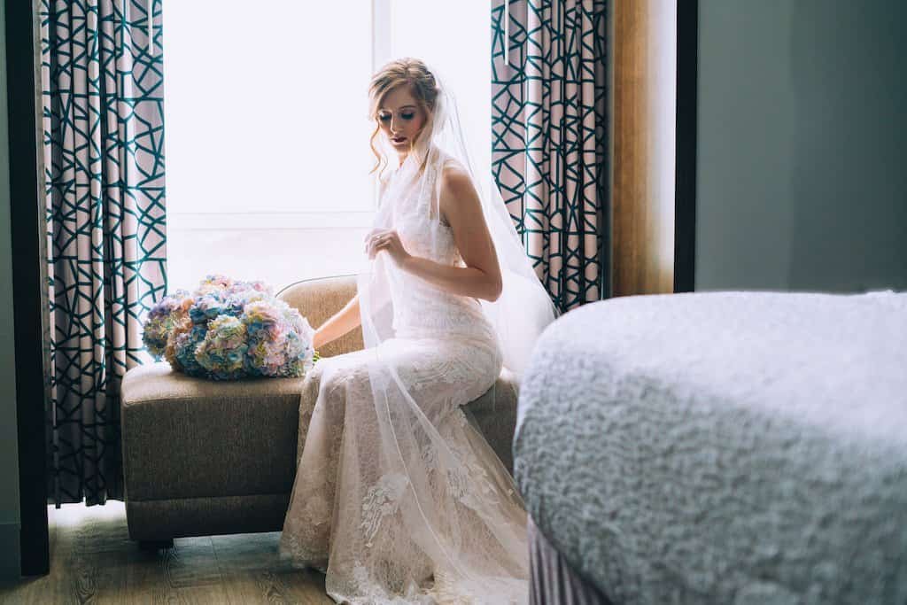 Bride and Groom Romantic Portrait in Front of Historic White Victorian Belleview Inn