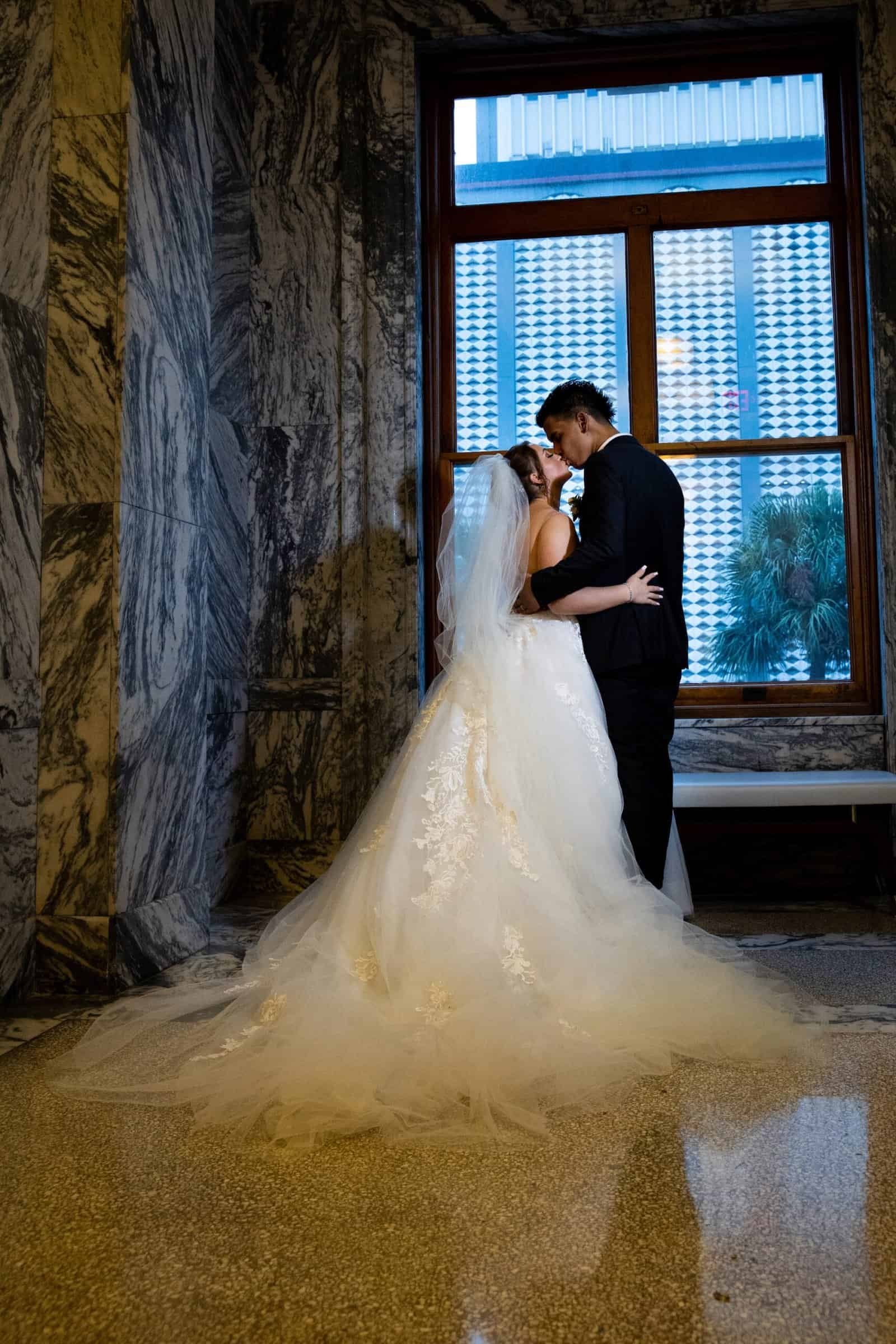 Historic white lawn ceremony with elegant floral arrangements at Belleview Inn