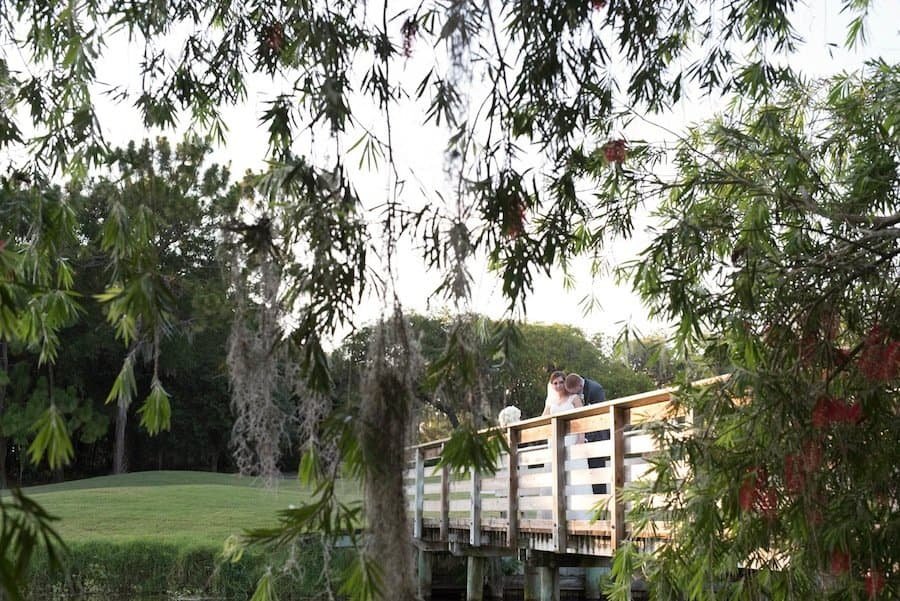 Sunset bride and groom portrait overlooking golf greens and woodlands at Innisbrook Resort