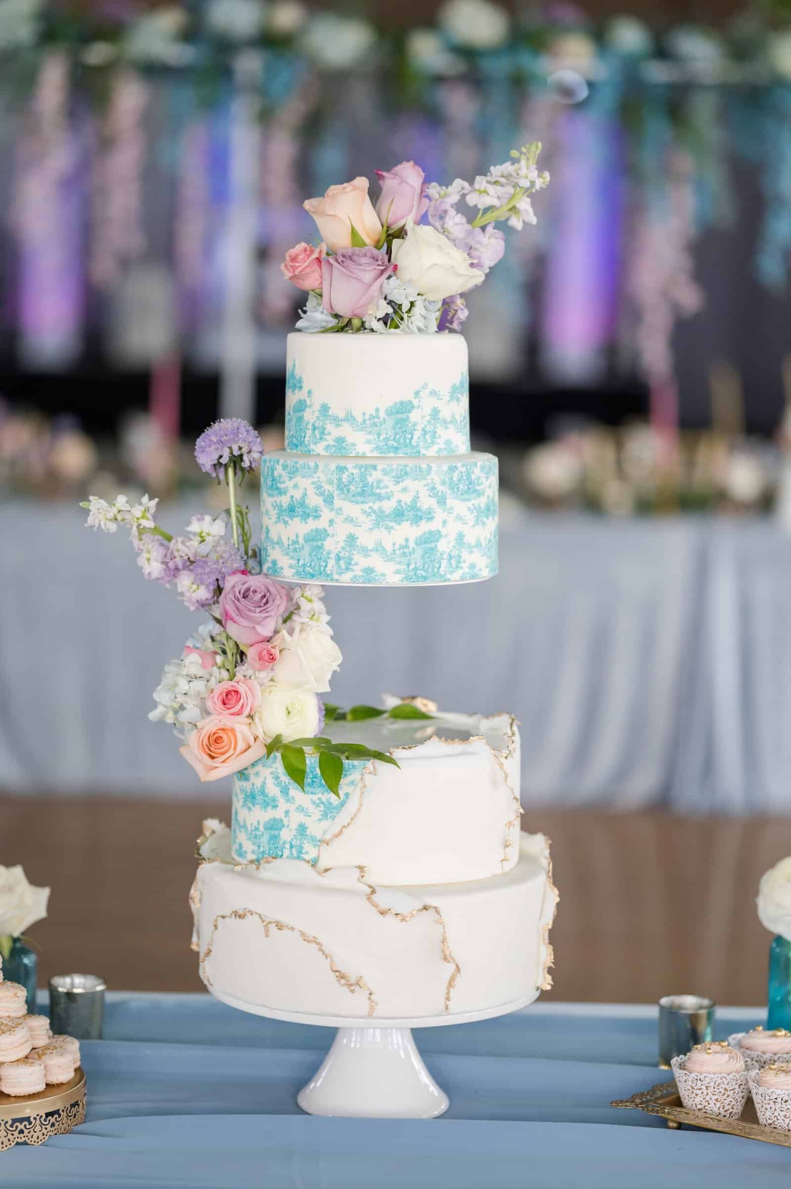 Whimsical spring blue, gold, and white Victorian floating wedding cake