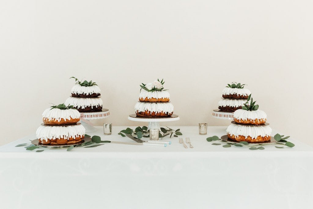 Organic Boho Wedding Cake Table with Multiple Two Tier Semi Naked Cakes by Nothing Bundt Cakes