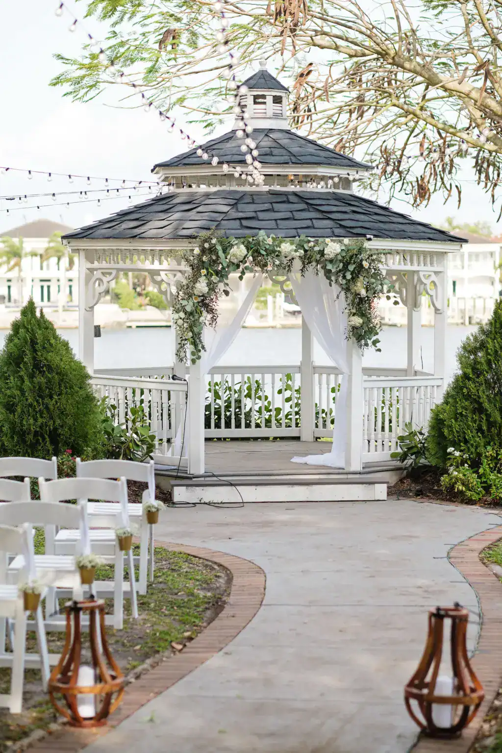 Bridal gown details and lush natural white and greenery bouquet for outdoor garden wedding