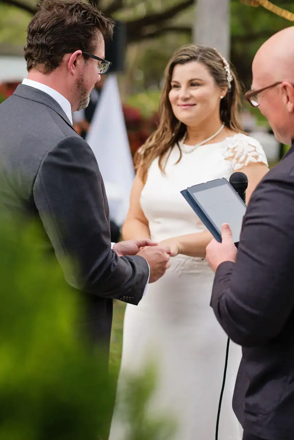 Couple portrait beneath illuminated live oak canopy draped in Gabro bistro lighting