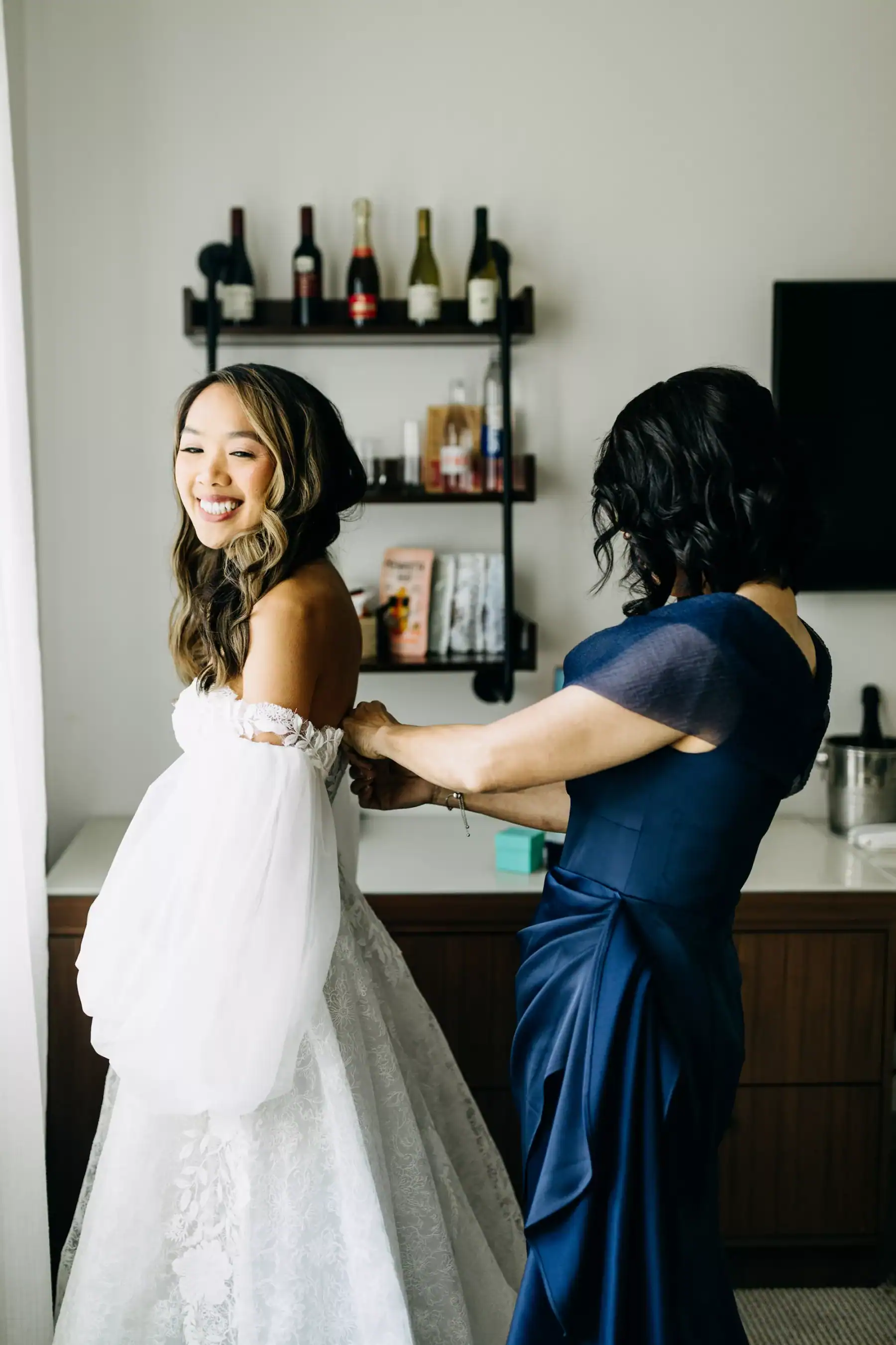Bride Getting Ready in White Lace Gown with Bridal Curls and Natural Makeup by Femme Akoi at The Fenway Hotel