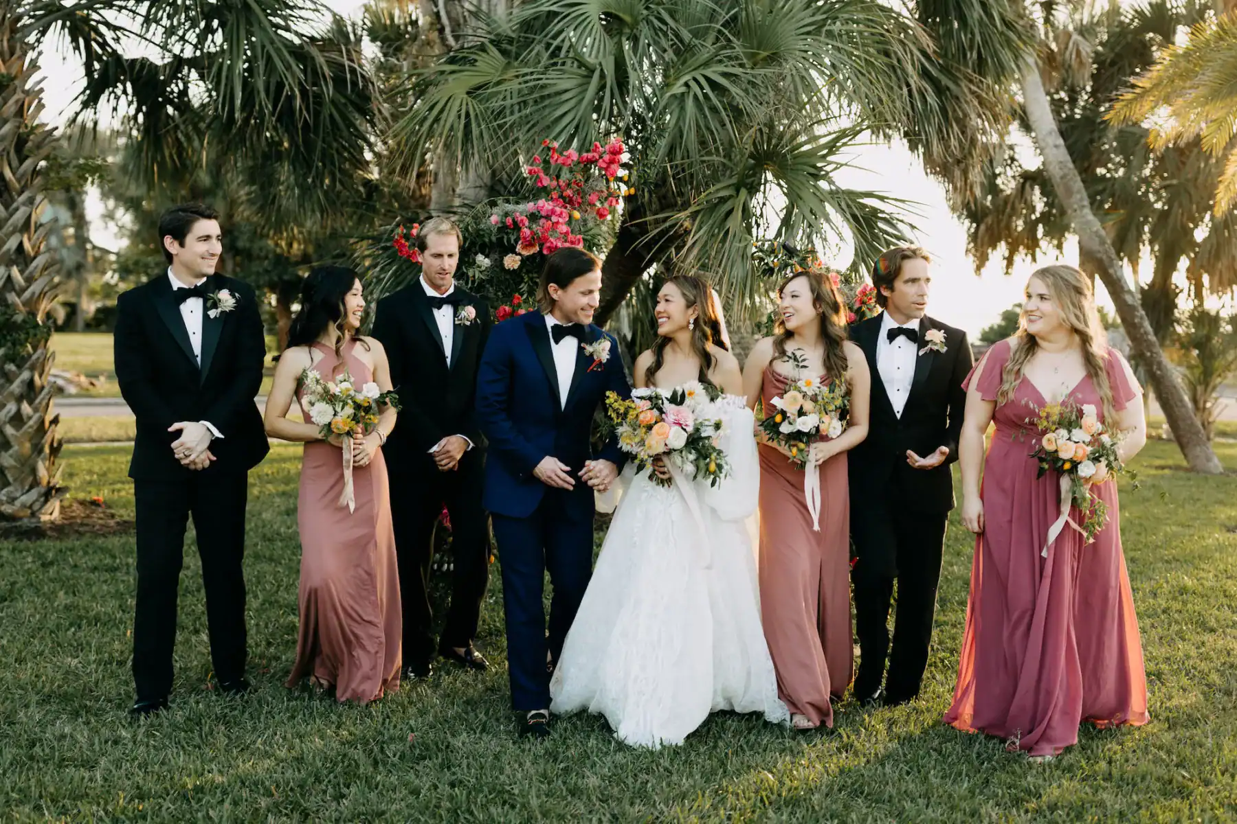 Wedding Party in Mismatched Coral Pink Dresses and Classic Black Tuxedos at The Fenway Hotel