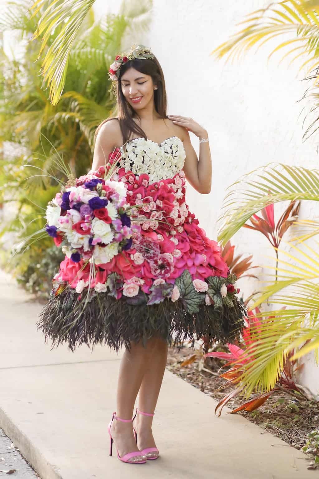 Full-length editorial portrait of model wearing custom living floral cocktail dress designed by Gabro Event Services
