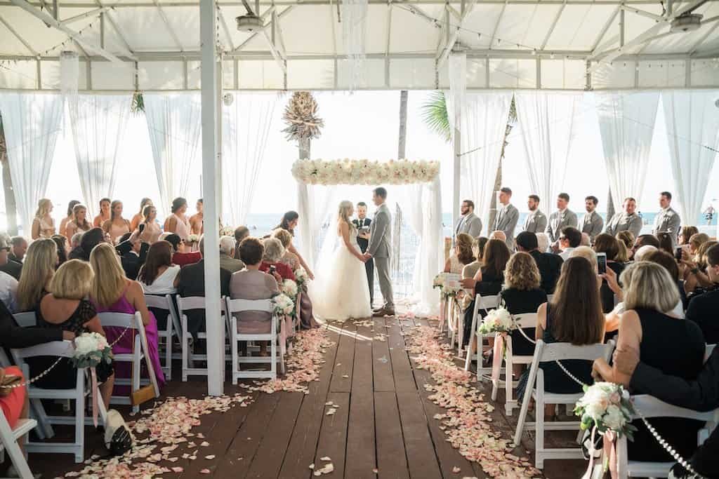 Oceanfront Wedding Ceremony Vows Under Draped Chuppah Arch by Gabro Event Services