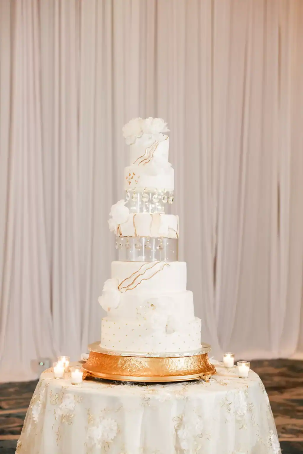 Round six-tier floating geode inspired gold and white wedding cake by The Artistic Whisk