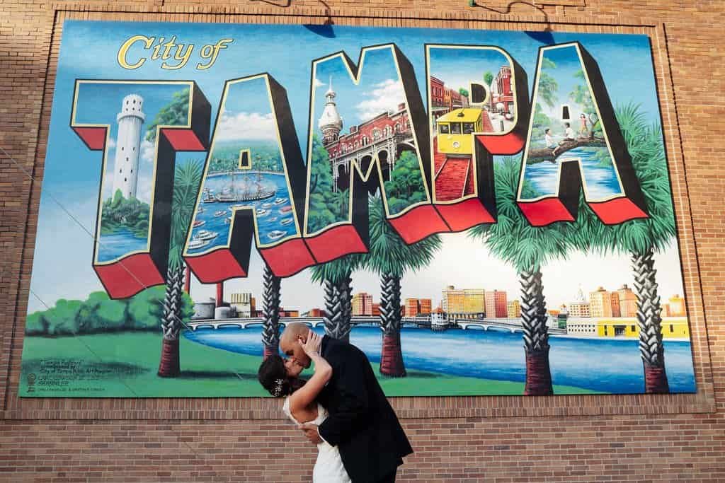 Bride and Groom Romantic Wedding Portrait in Front of Iconic City of Tampa Art Mural