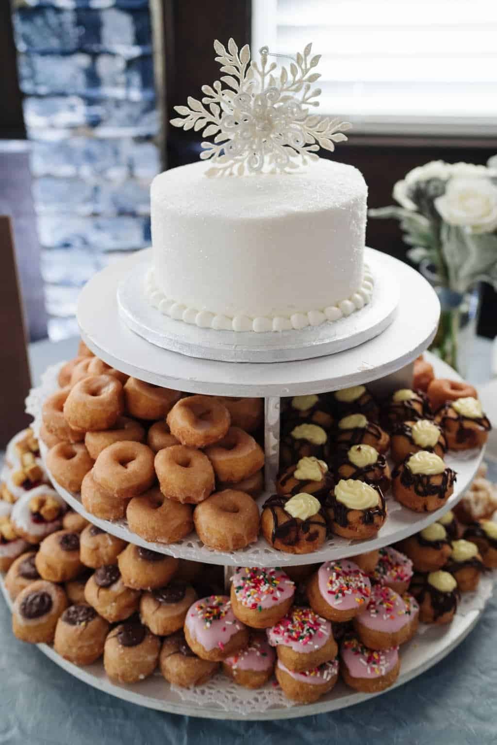 Winter Wonderland Dessert Display with Mini Donuts by Little Donut House and Snowflake Wedding Cake