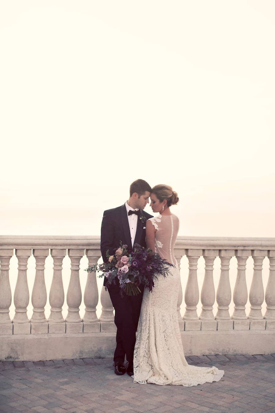 Couple Embracing on the 16th Floor Sky Terrace Overlooking the Gulf of Mexico