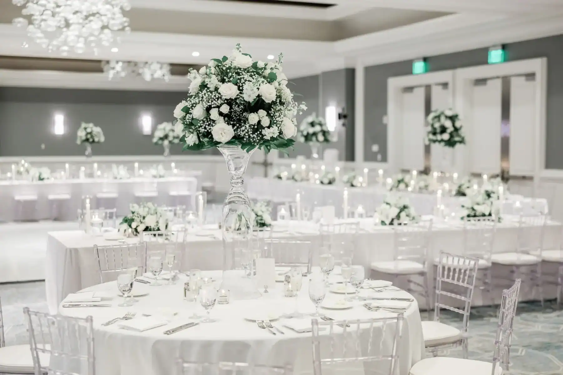Grand ballroom reception featuring Gabro Event Services seamless white dance floor, feasting tables, and full perimeter draping
