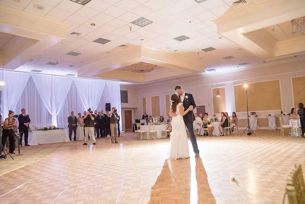 Bride and Groom First Dance in Front of Gabro Event Services Stage Backdrop Fabric Draping at Innisbrook Resort
