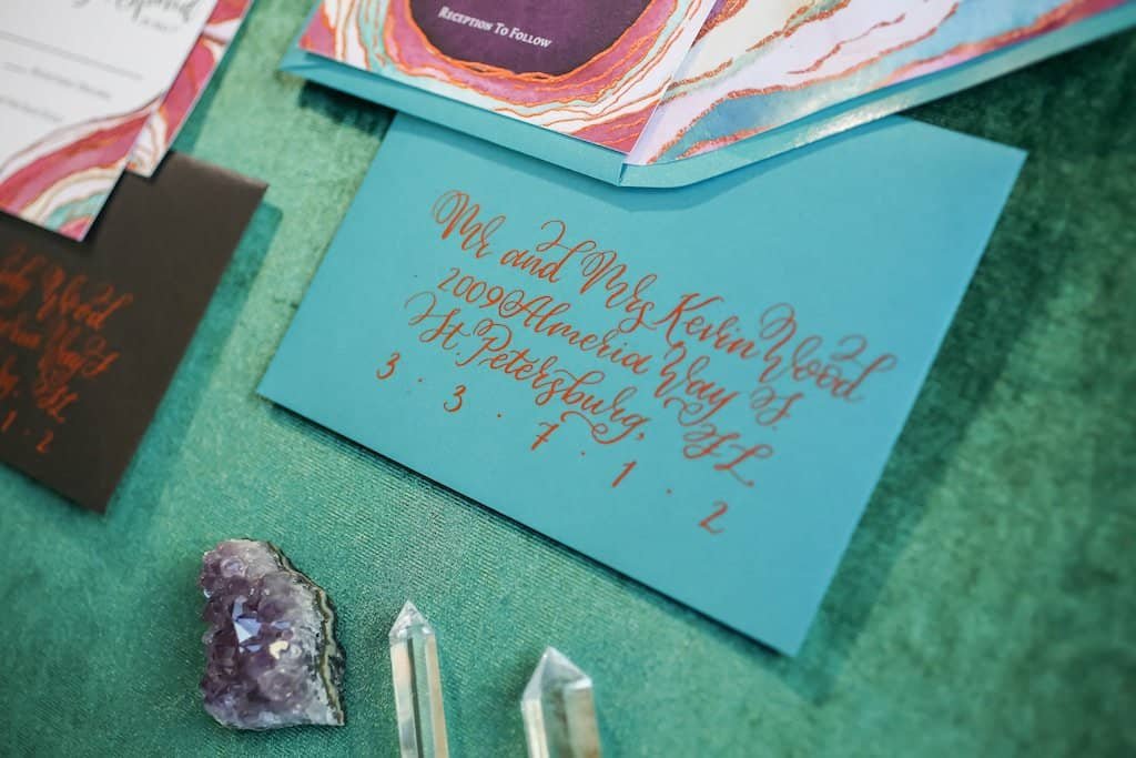 Artisanal geode wedding cake with hand-crafted sugar crystals and metallic copper leaf detailing