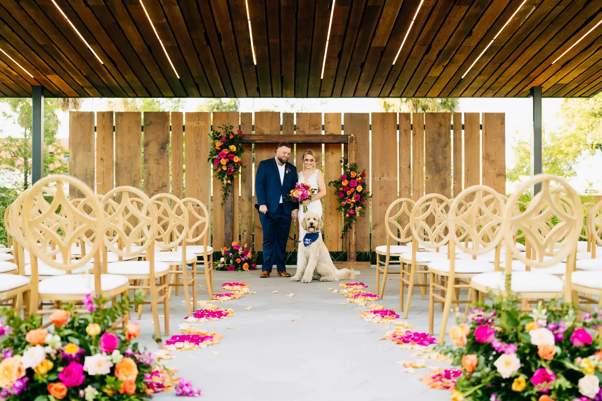 Bride and groom with dog just married portrait at JC Newman Cigar Co in Ybor City