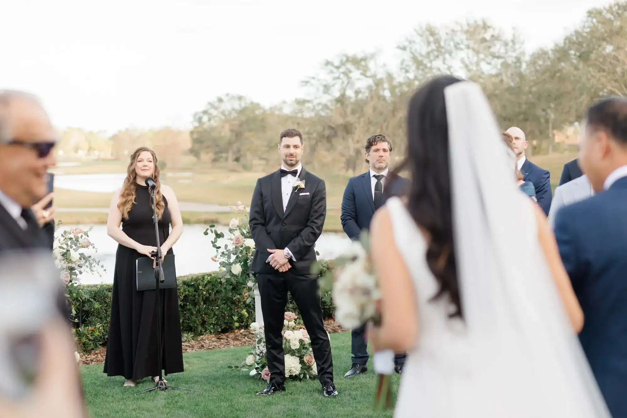 The newlyweds sharing their choreographed first dance in a formal ballroom setting.