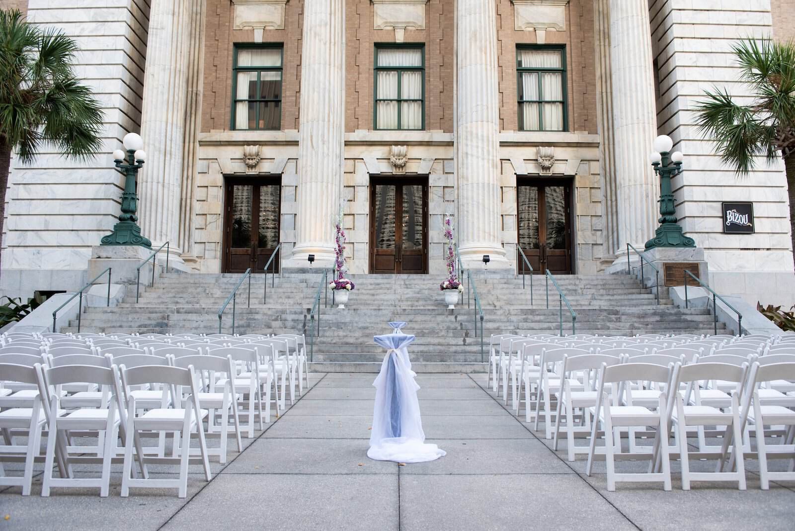 Elegant reception table settings with black linens and architectural chargers at Le Meridien.