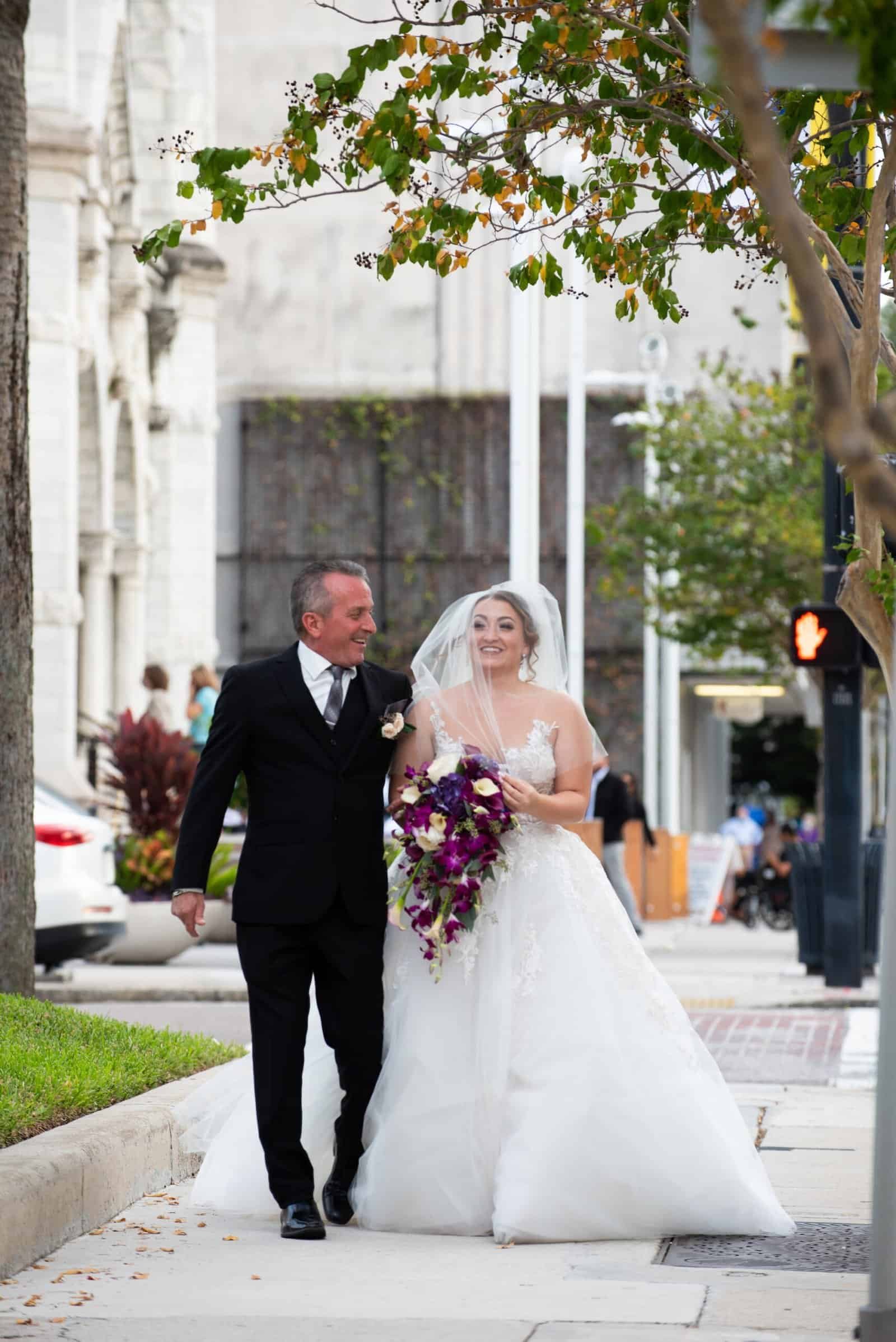 The happy couple exchanging vows during their moody October ceremony in Tampa.