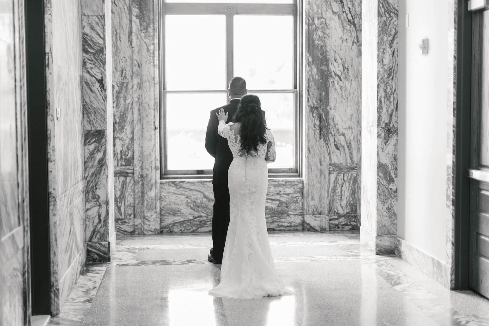 An elegant black-tie surprise wedding ceremony set against the historic architecture of Le Meridien.