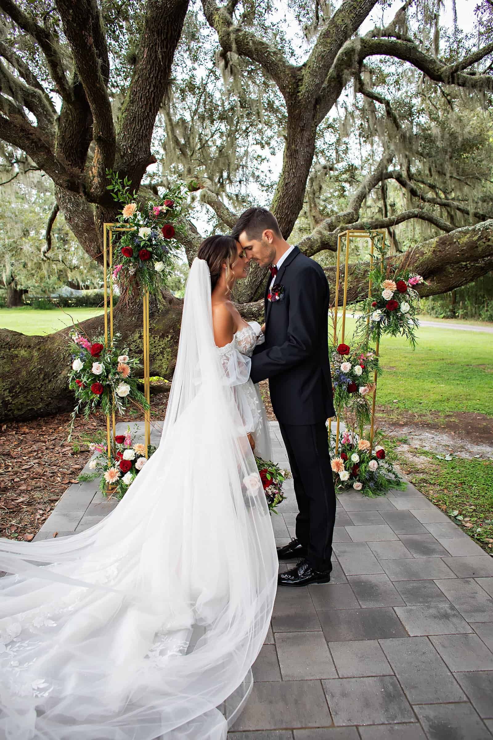 The all-white Reception Barn at Legacy Lane Weddings featuring romantic lighting and greenery.