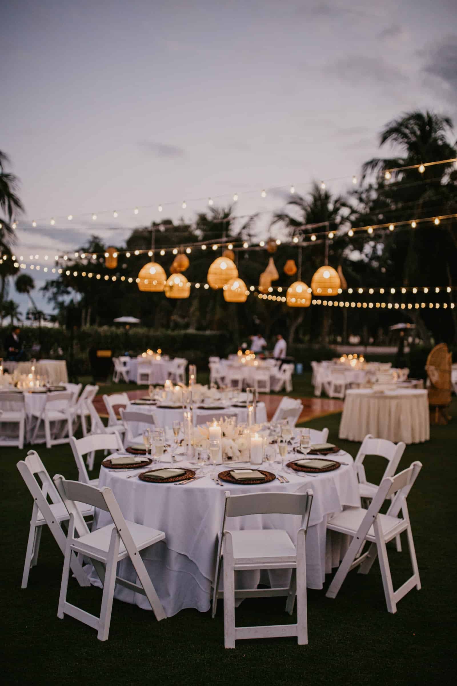 Luxurious tented reception ballroom with crystal chandeliers and custom draping