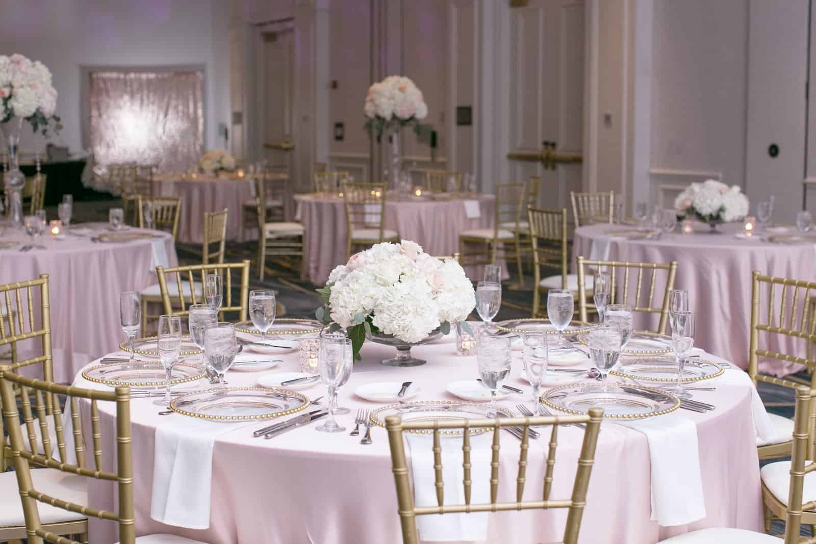 Grand Ballroom Reception at Tampa Marriott Water Street with Blush Table Linens and Gold Chiavari Chairs by Gabro Event Services