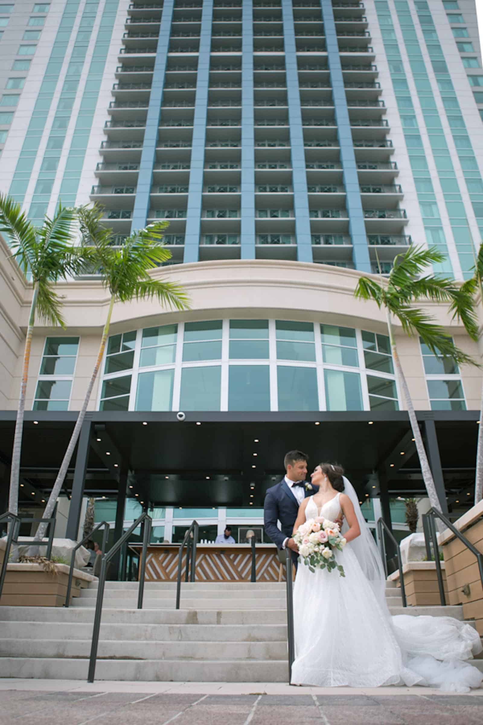 Bride and Groom Romantic Wedding Portrait at Tampa Marriott Water Street Hotel along the Riverwalk