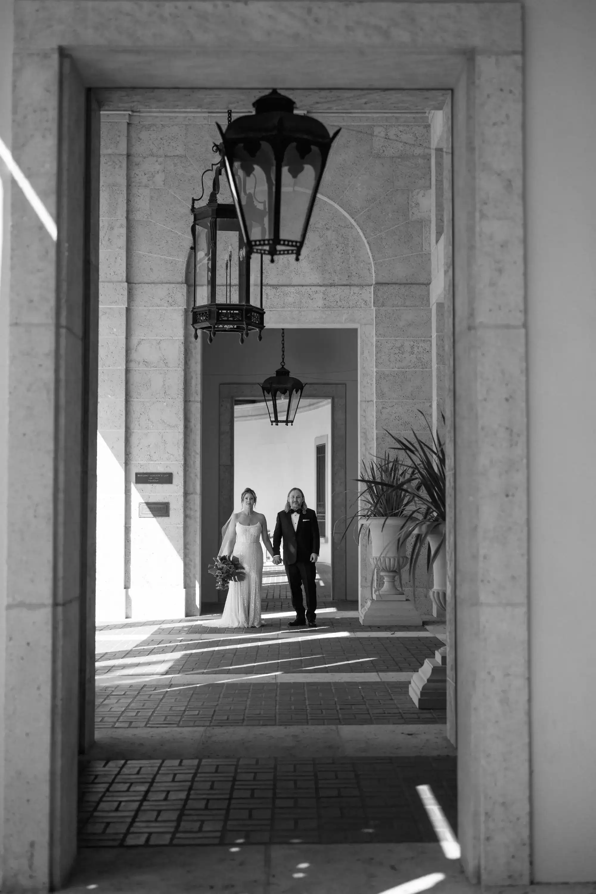 Newlywed sunset couple portrait framed by historic giant banyan trees along Beach Drive