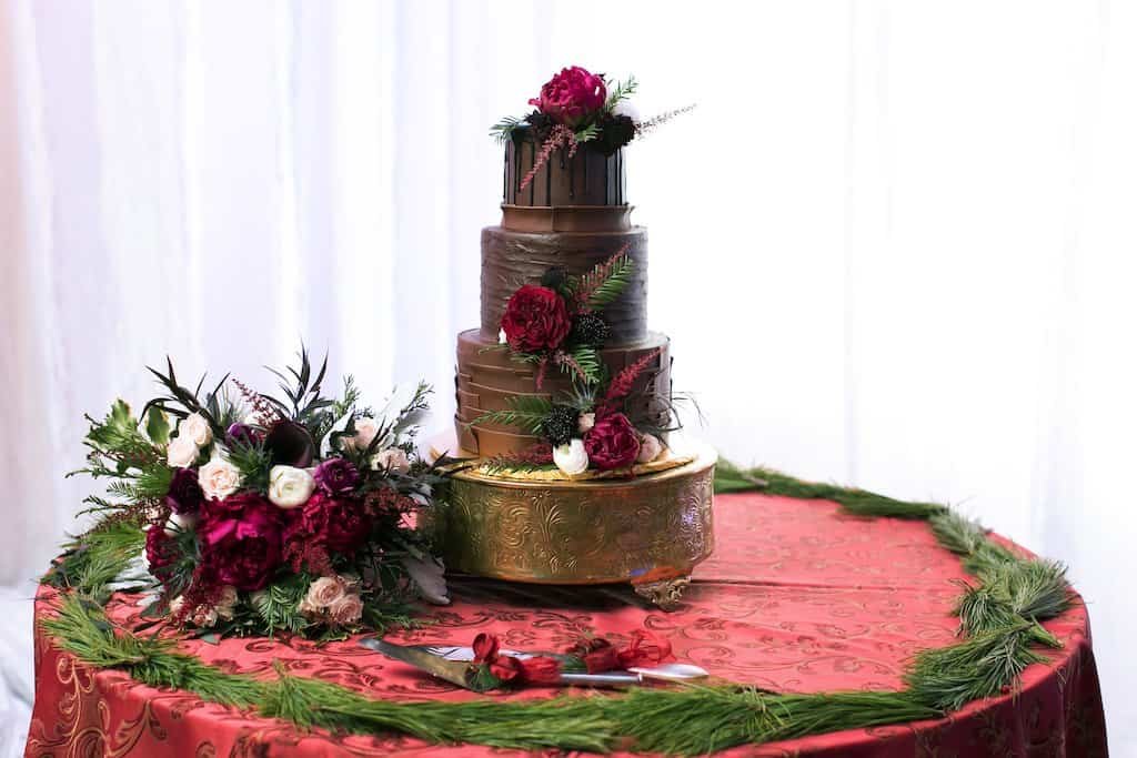 Romantic Indoor Ceremony at Morean Center for Clay with Exposed Historic Brick, Polished Concrete Floors, and Circular Wooden Floral Arch