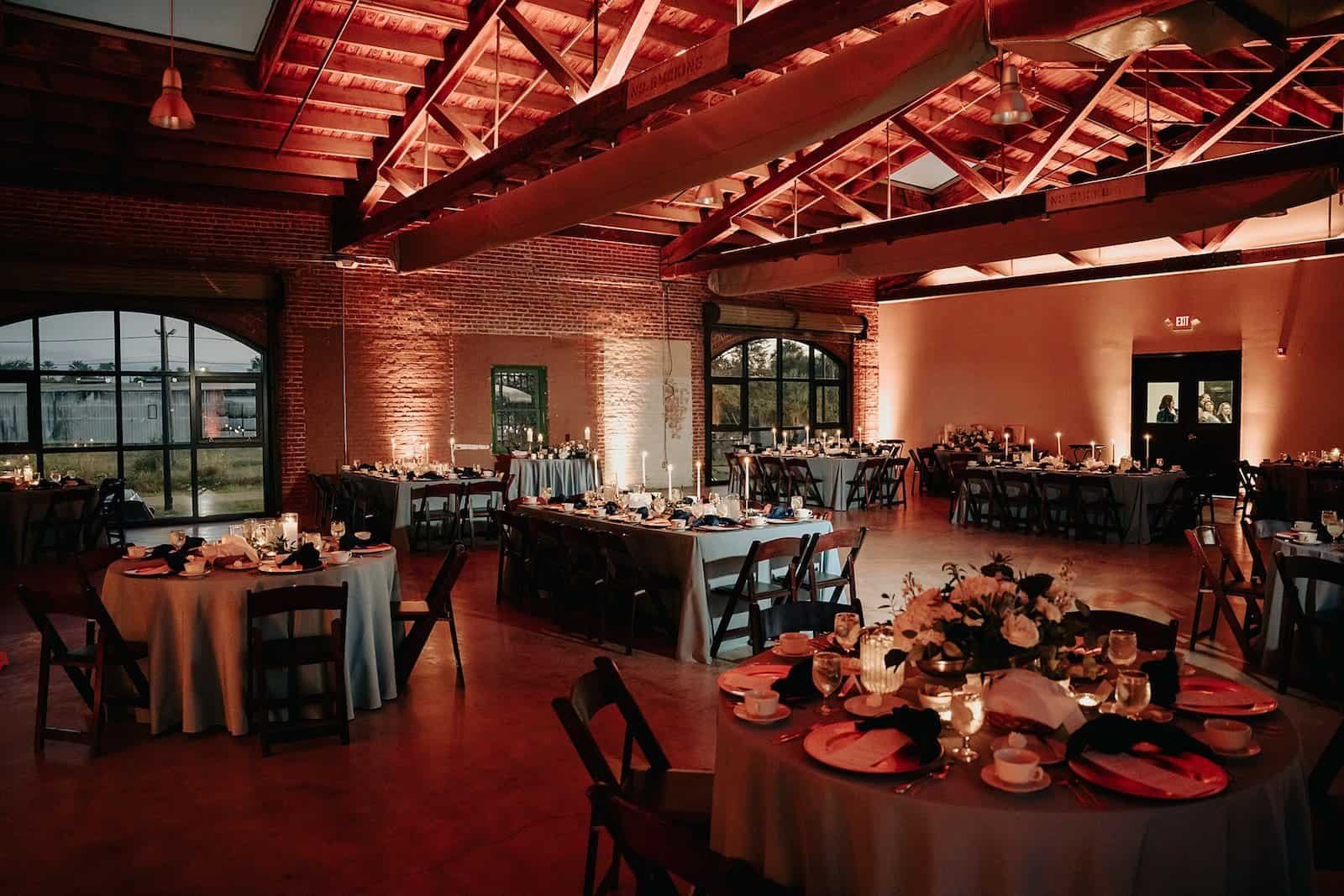 Industrial Indoor Reception with Blue Linens and Gabro Event Services Draping at Morean Center for Clay