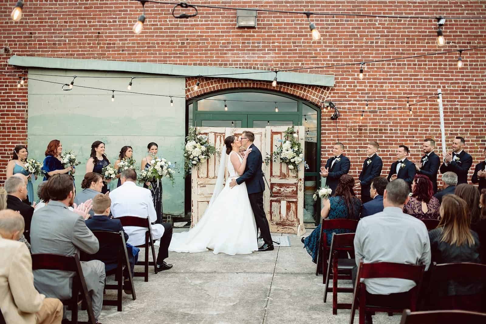 Bride and Groom First Kiss at Morean Center for Clay Wedding Ceremony