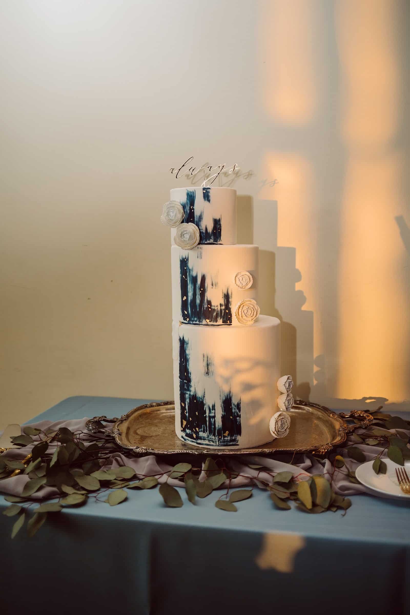 Three Tier Modern Wedding Cake with Blue Detailing and Gold Cake Topper by Kristen Marie Cakes