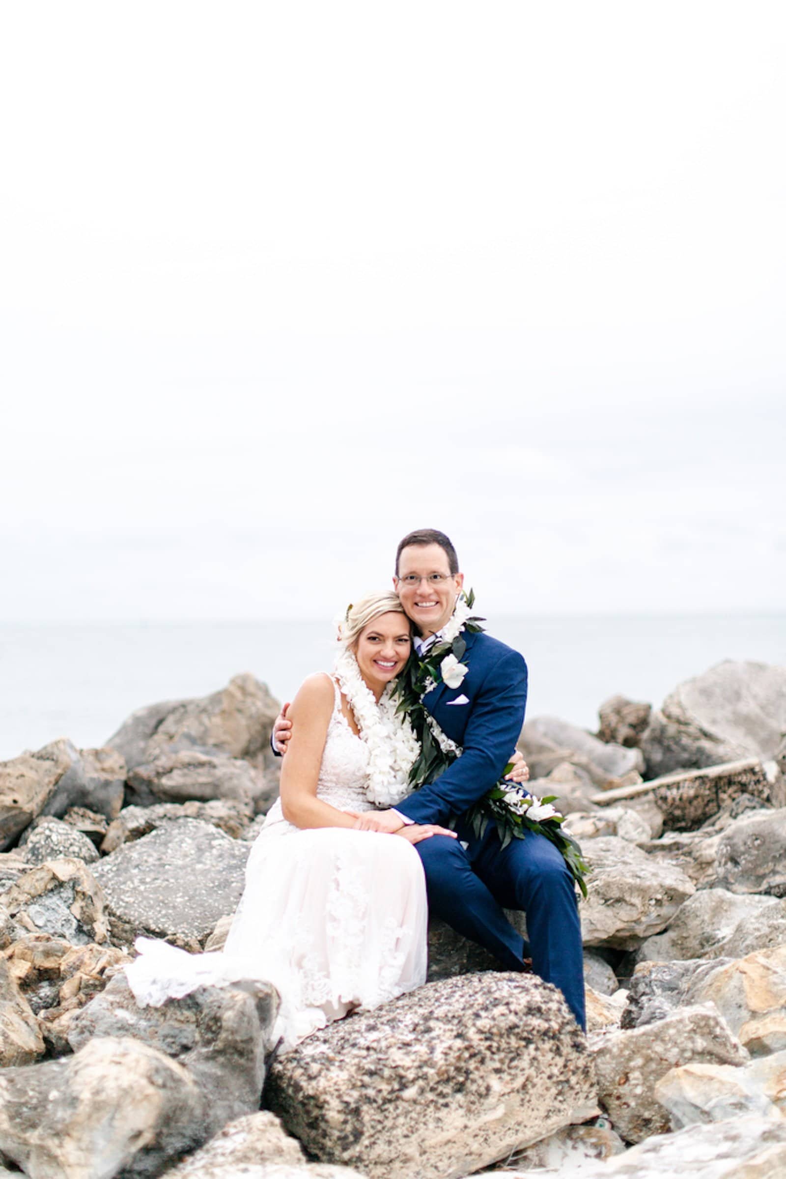 Bride and Groom Romantic Sunset Wedding Portrait on the Clearwater Beach Rocks at Opal Sands Resort