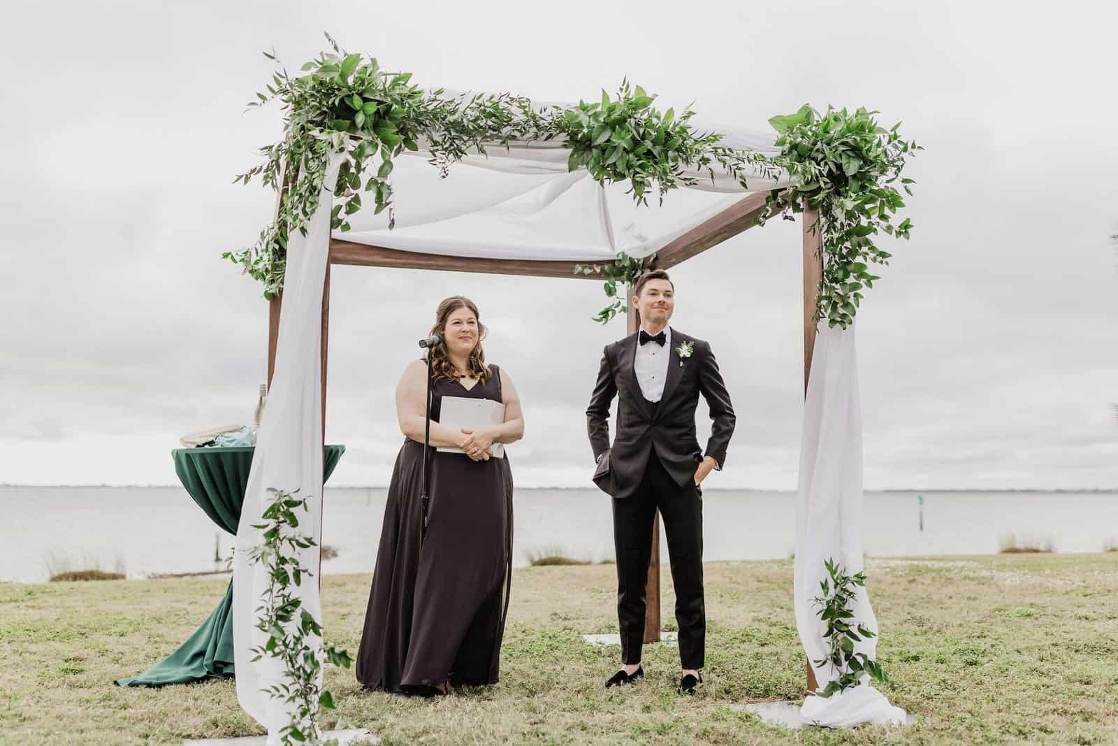 Botanical ceremony arbor framed by tropical plants and foliage at Fancy Free Nursery