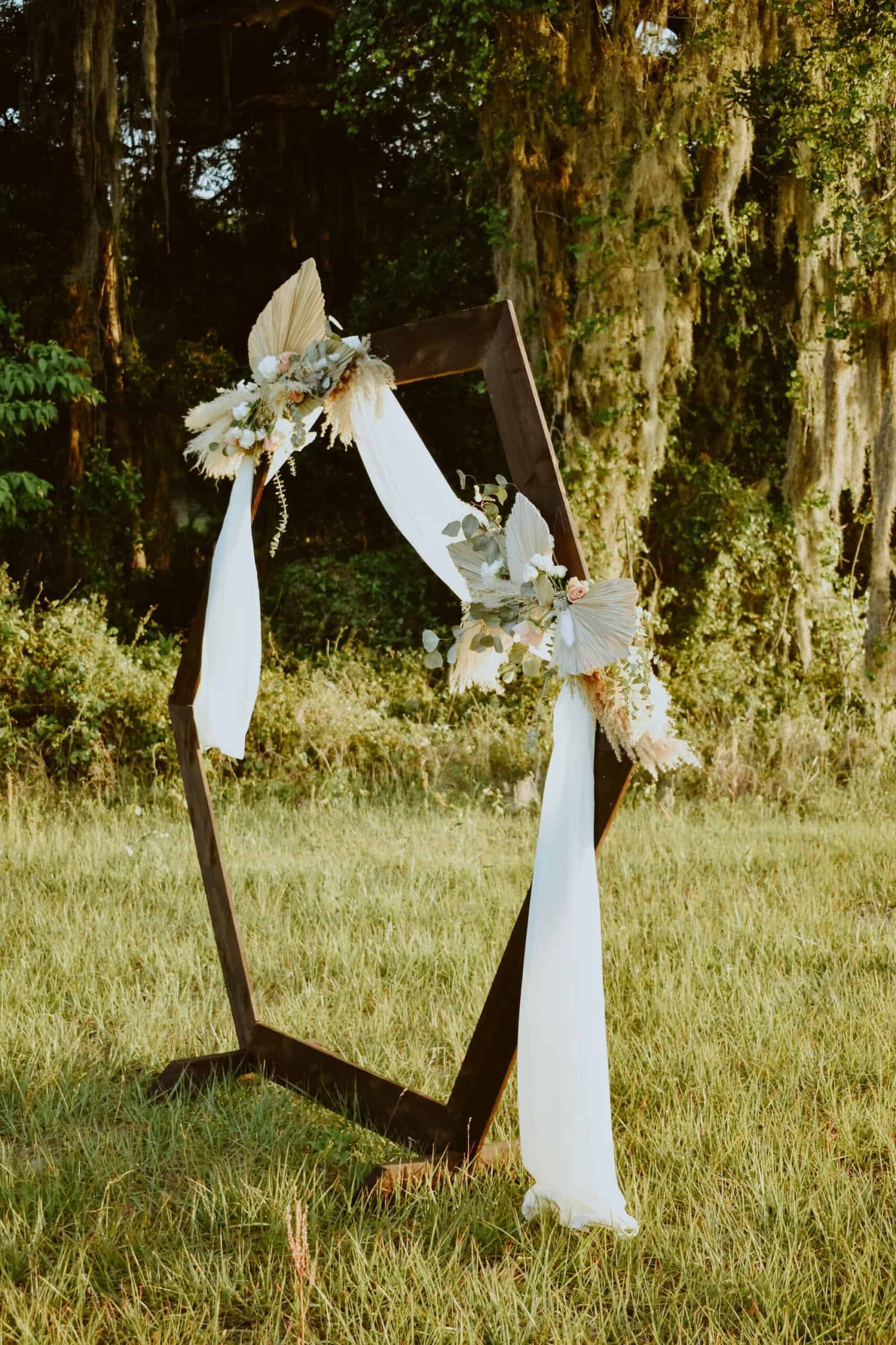 Bride and Groom Posing on the Rolling Green Lawns of Prim Acres at Sunset