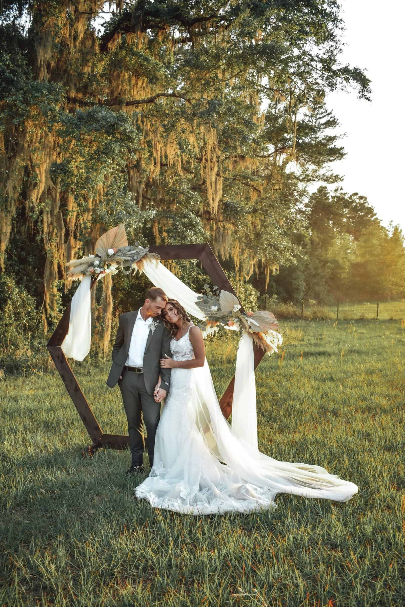 Boho Bride Wearing Textured Lace Cap-Sleeve Gown from Truly Forever Bridal